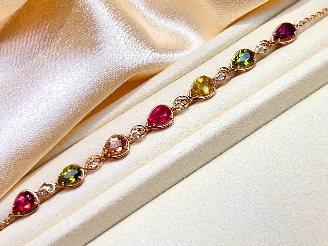 14k Gold 5.8 Ct Natural Tourmaline & Diamond Bracelet: Ref:231172294 // gold content:14k gold // main gemstone:tourmaline // shape:pear // carat weight:5. 8ct // color:color // treatment:natural // // adjacent gemstone 2 : diamond // number of stones:30
