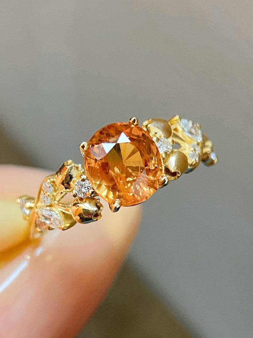 14k Gold 1.87 Ctw Natural Sapphire & Diamond Ring: Ref:231172304 // gold content:14k gold // ring size:7. 25us // // main gemstone:sapphire // shape:oval // carat weight:1. 69ct // color:orange // treatment:natural // // adjacent gemstone 2 : diamond 