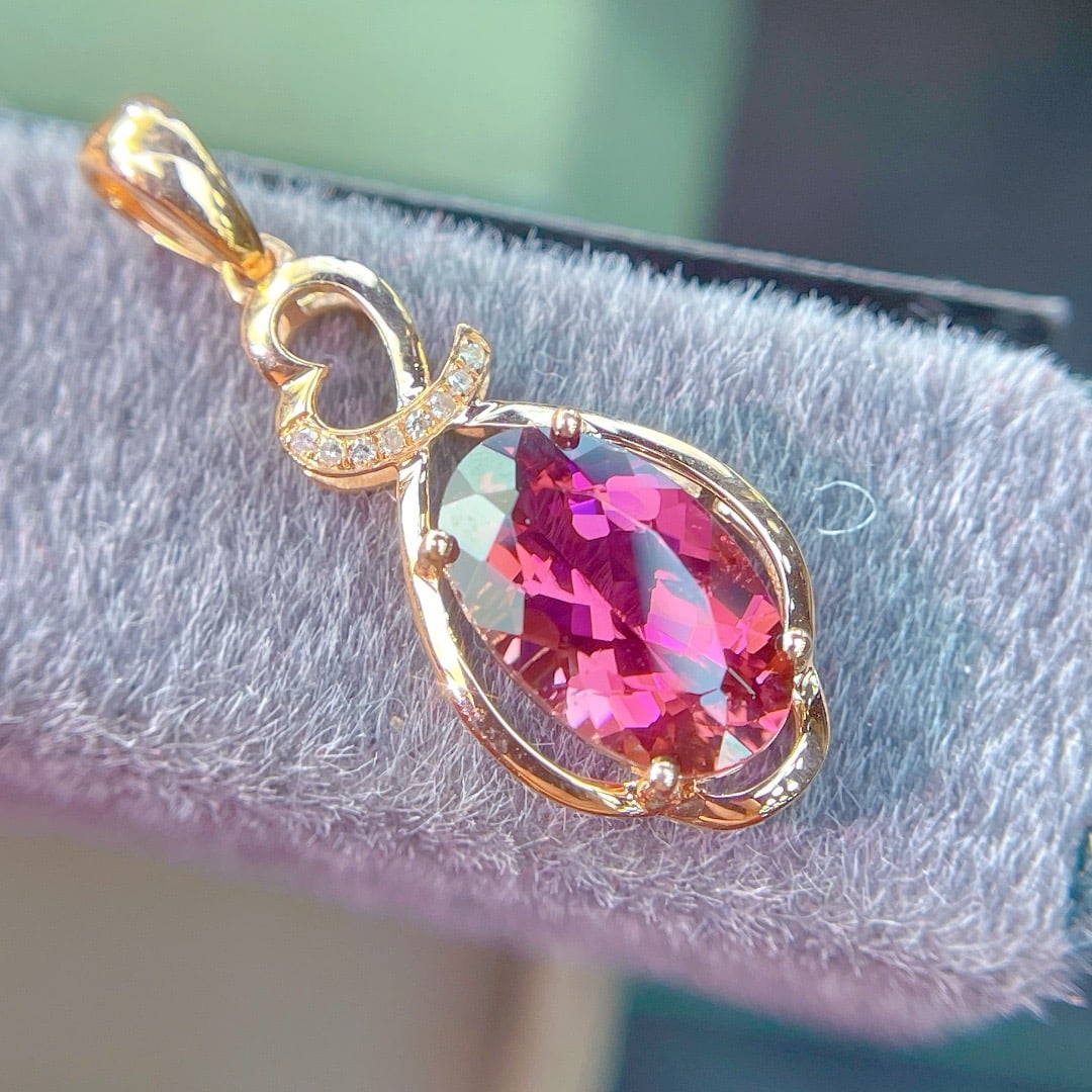 14k Gold 2.55 Ct Natural Tourmaline & Diamond Pendant( Without Chain ): Ref:231172316 // gold content:14k gold // main gemstone:tourmaline // shape:oval // carat weight:2. 55ct // color:red // treatment:natural // // adjacent gemstone 2 : diamond // shape:round //