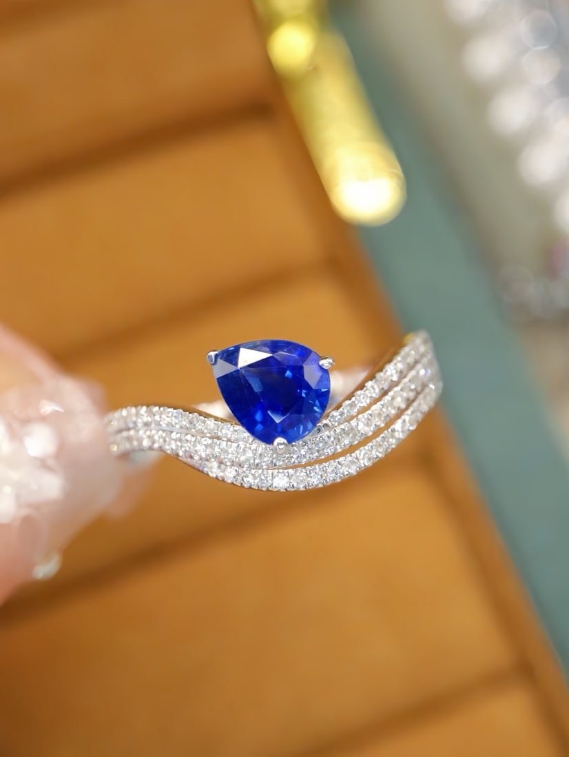 14k Gold 1.20 Ctw Natural Sapphire & Diamond Ring: Ref:231172379 // gold content:14k gold // ring size:7. 25us // // main gemstone:sapphire // shape:pear // carat weight:0. 97ct // color:blue // treatment:natural // // adjacent gemstone 2 : diamond