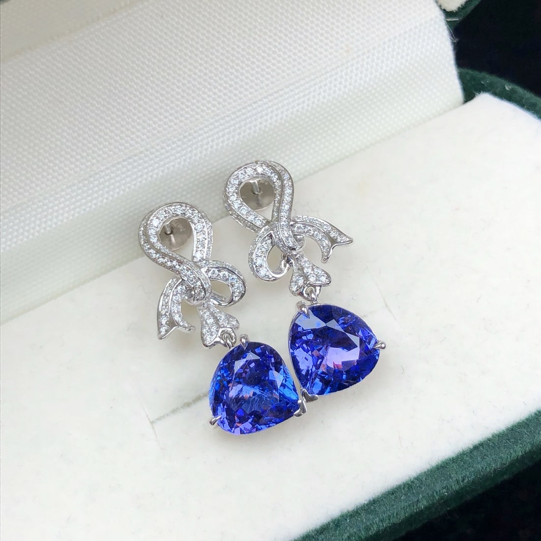 14k Gold 3.83 Ctw Natural Tanzanite & Diamond Earrings: Ref:231172423 // gold content:14k gold // main gemstone:tanzanite // shape:pear // carat weight:3. 36ct // color:blue // treatment:natural // // adjacent gemstone 2 : diamond // shape:round // carat