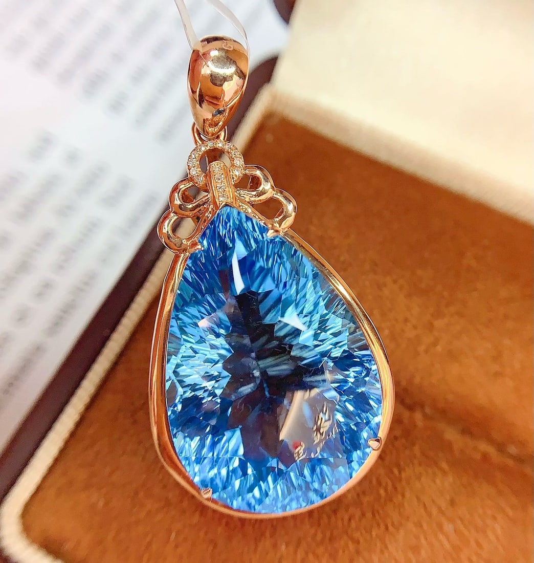 14k Gold 34 Ct Natural Topaz & Diamond Pendant( Without Chain ): Ref:231172426 // gold content:14k gold // main gemstone:topaz // shape:pear // carat weight:34ct // color:blue // treatment:natural // // adjacent gemstone 2 : diamond // number of stones:15 //