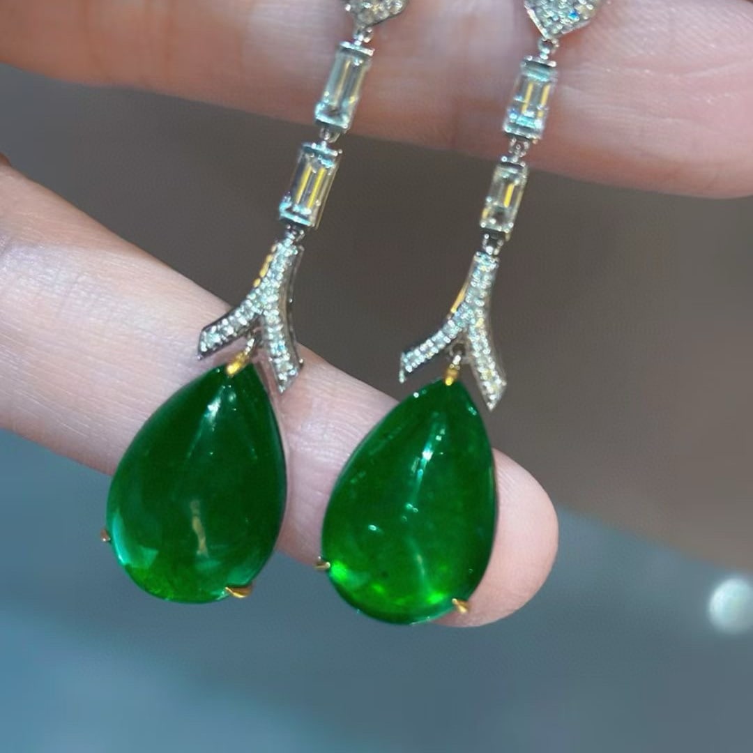 14k Gold 16.18 Ct Vivid Green Natural Emerald & Diamond Earrings: Ref:231058349 // gold content:14k gold // main gemstone:emerald // shape:pear // carat weight:16. 18ct // color:vivid green // treatment:natural // // adjacent gemstone 2 : diamond // shape:round // c