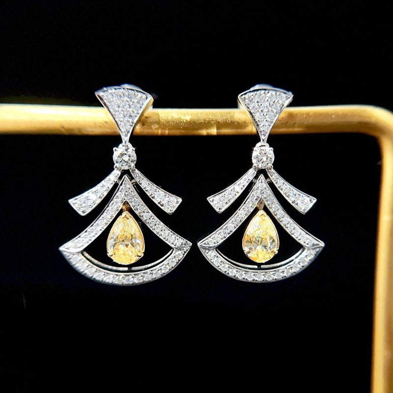 14k Gold 1.2 Ctw Natural Yellow Diamond & Diamond Earrings: Ref:231065113 // gold content:14k gold // main gemstone:yellow diamond // shape:pear // carat weight:0. 6ct // color:yellow // treatment:natural // // adjacent gemstone 2 : diamond // shape:round // c