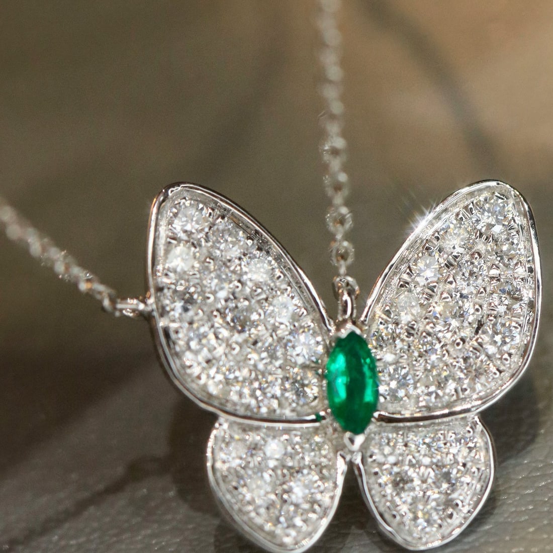 14k Gold 0.58 Ctw Vivid Green Natural Emerald & Diamond & Butterfly Necklace: Ref:231066027 // gold content:14k gold // main gemstone:emerald // shape:marquise // carat weight:0. 08ct // color:vivid green // treatment:natural // // adjacent gemstone 2 : diamond // shape:round /