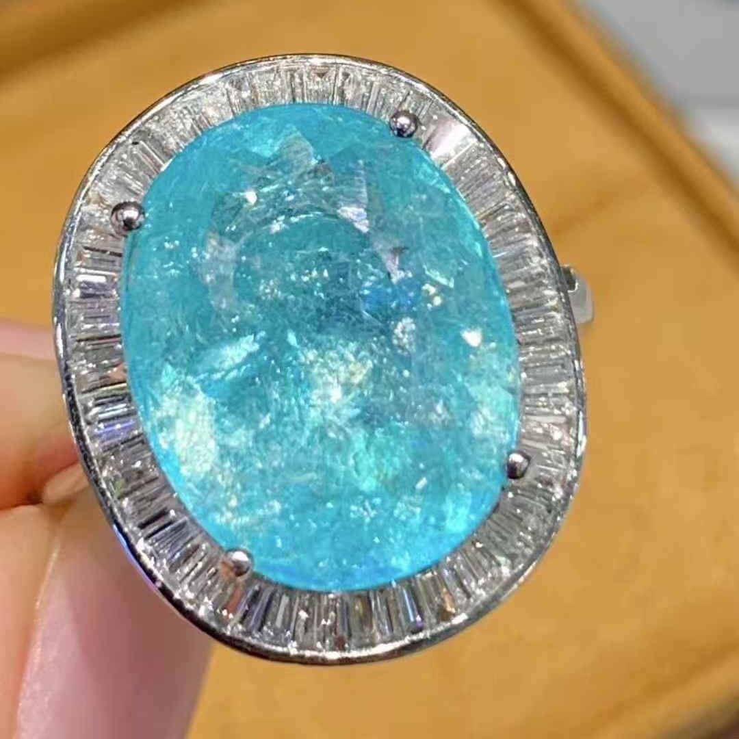 14k Gold 6.6 Ct Natural Paraiba Tourmaline & Diamond Ring: Ref:231067011 // gold content:14k gold // ring size:7. 25 us // // main gemstone:paraiba tourmaline // shape:oval // carat weight:6. 6ct // color:blue // treatment:natural // // adjacent gemstone 2 :