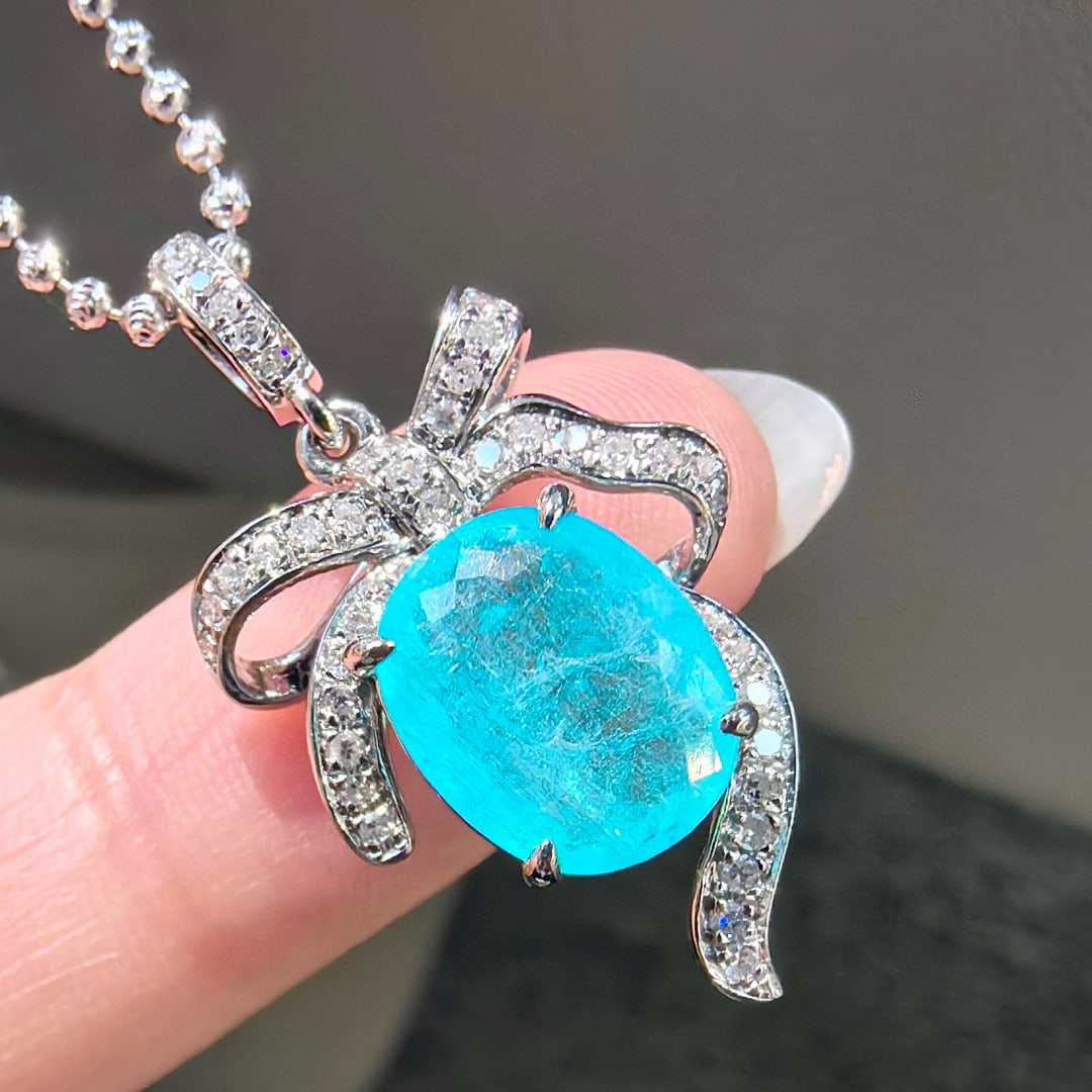 14k Gold 2.76 Ctw Natural Paraiba Tourmaline & Diamond Pendant( Without Chain ): Ref:231067168 // gold content:14k gold // main gemstone:paraiba tourmaline // shape:oval // carat weight:2. 52ct // color:blue // treatment:natural // // adjacent gemstone 2 : diamond // shape:round /