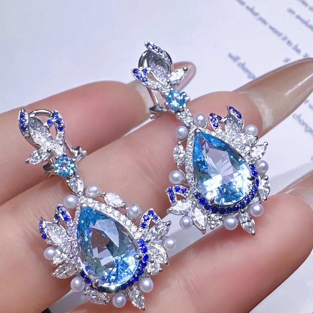 14k Gold 7.33 Ctw Natural Aquamarine & Diamond Earrings: Ref:231068126 // gold content:14k gold // main gemstone:aquamarine // shape:pear // carat weight:5. 9ct // color:santa maria color // treatment:natural // // adjacent gemstone 2 : diamond // shape:mul