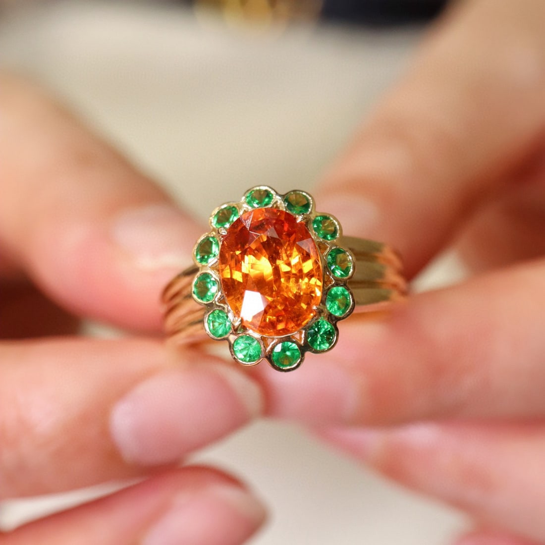 14k Gold 2.14 Ct Natural Spessartine & Tsavorite Ring: Ref:231070349 // gold content:14k gold // ring size:7. 25us // // main gemstone:spessartine // shape:oval // carat weight:2. 14ct // color:orange // treatment:natural // // adjacent gemstone 2 :