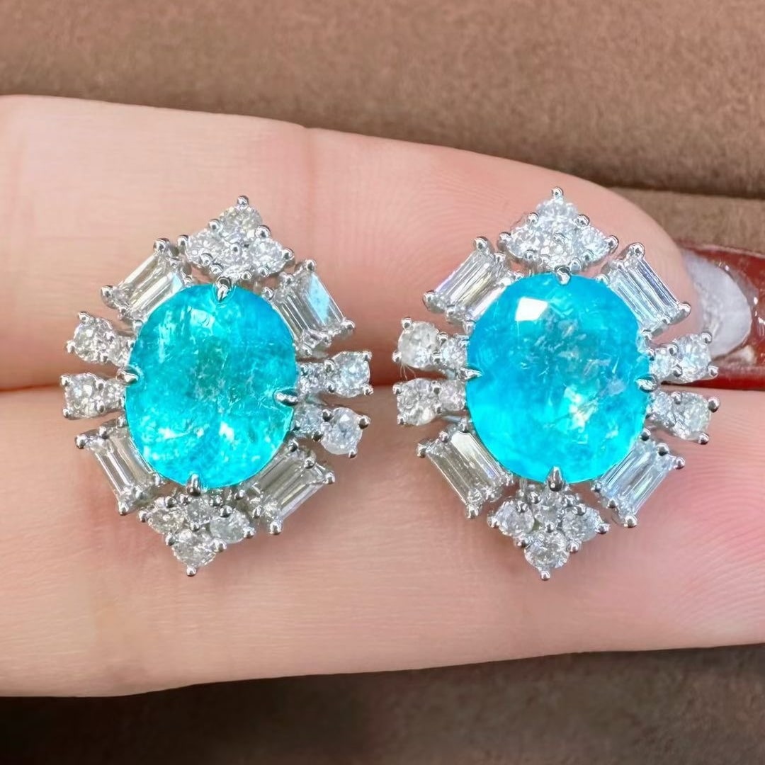 14k Gold 7.12 Ctw Natural Paraiba Tourmaline & Diamond Earrings: Ref:231073014 // gold content:14k gold // main gemstone:paraiba tourmaline // shape:oval // carat weight:5. 72ct // color:blue // treatment:natural // // adjacent gemstone 2 : diamond // shape:multipl