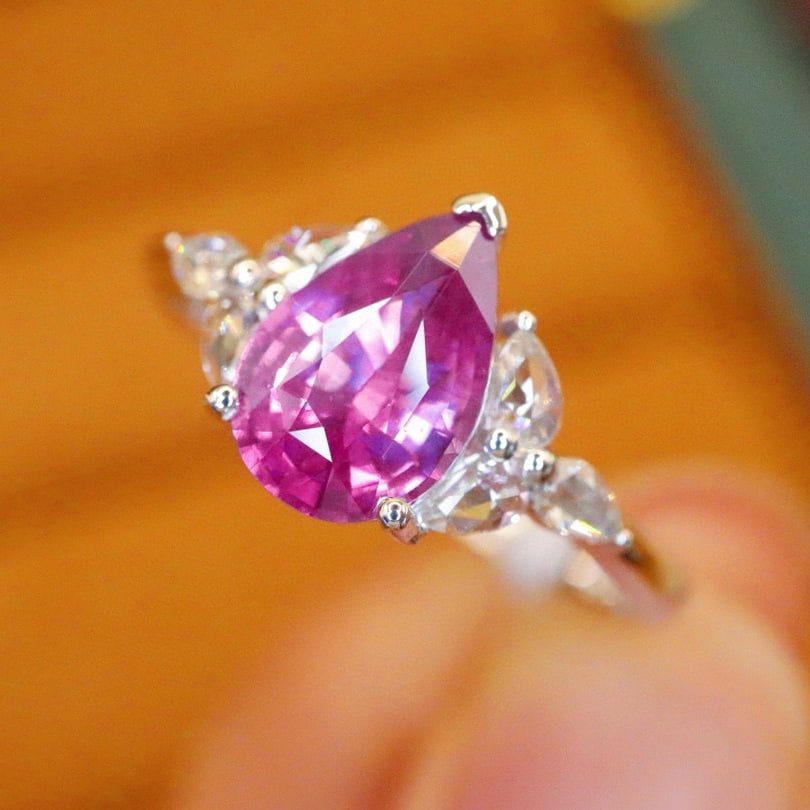 14k Gold 1.22 Ctw Natural Sapphire & Diamond Ring: Ref:231073064 // gold content:14k gold // ring size:7. 25us // // main gemstone:sapphire // shape:pear // carat weight:1. 06ct // color:pinkish purple // treatment:natural // // adjacent gemstone 2 :