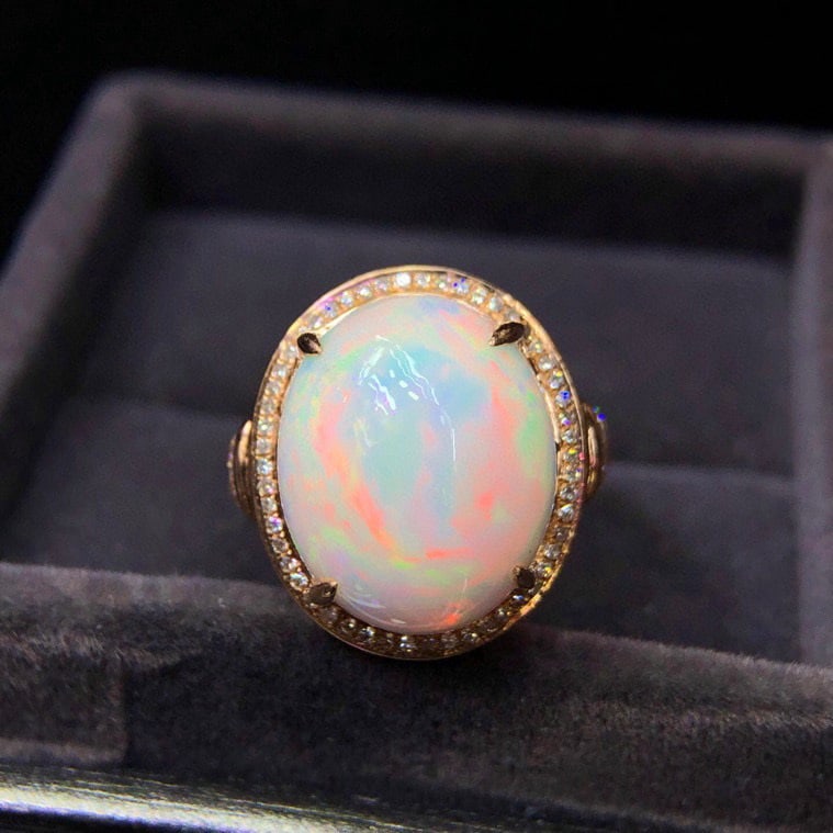 14k Gold 9.10 Ct Natural Opal & Diamond Ring: Ref:231073105 // gold content:14k gold // ring size:7. 25us // // main gemstone:opal // shape:oval // carat weight:9. 10ct // color:color // treatment:natural // // adjacent gemstone 2 : diamond // nu