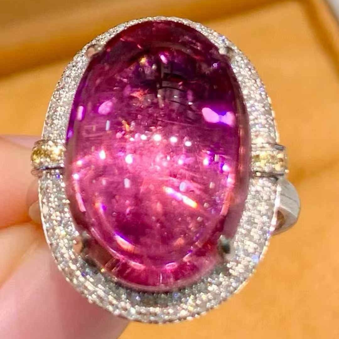 14k Gold 10.3 Ct Natural Tourmaline & Diamond Ring: Ref:231073125 // gold content:14k gold // ring size:7. 25us // // main gemstone:tourmaline // shape:oval // carat weight:10. 3ct // color:red // treatment:natural // // adjacent gemstone 2 :
