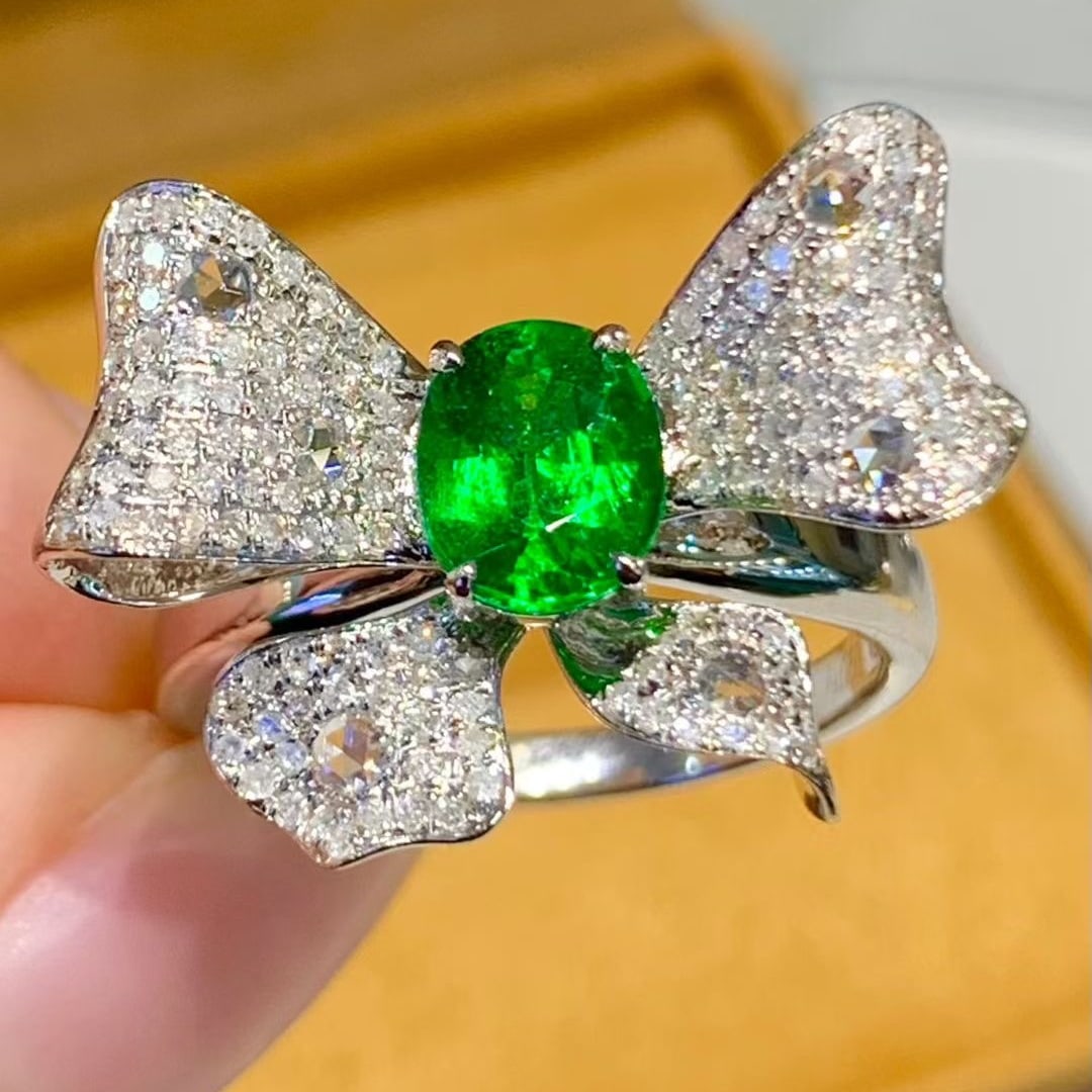 14k Gold 1.1 Ct Vivid Green Natural Tsavorite & Diamond Ring: Ref:231073137 // gold content:14k gold // ring size:7. 25us // // main gemstone:tsavorite // shape:oval // carat weight:1. 1ct // color:vivid green // treatment:natural // // adjacent gemstone 2 :