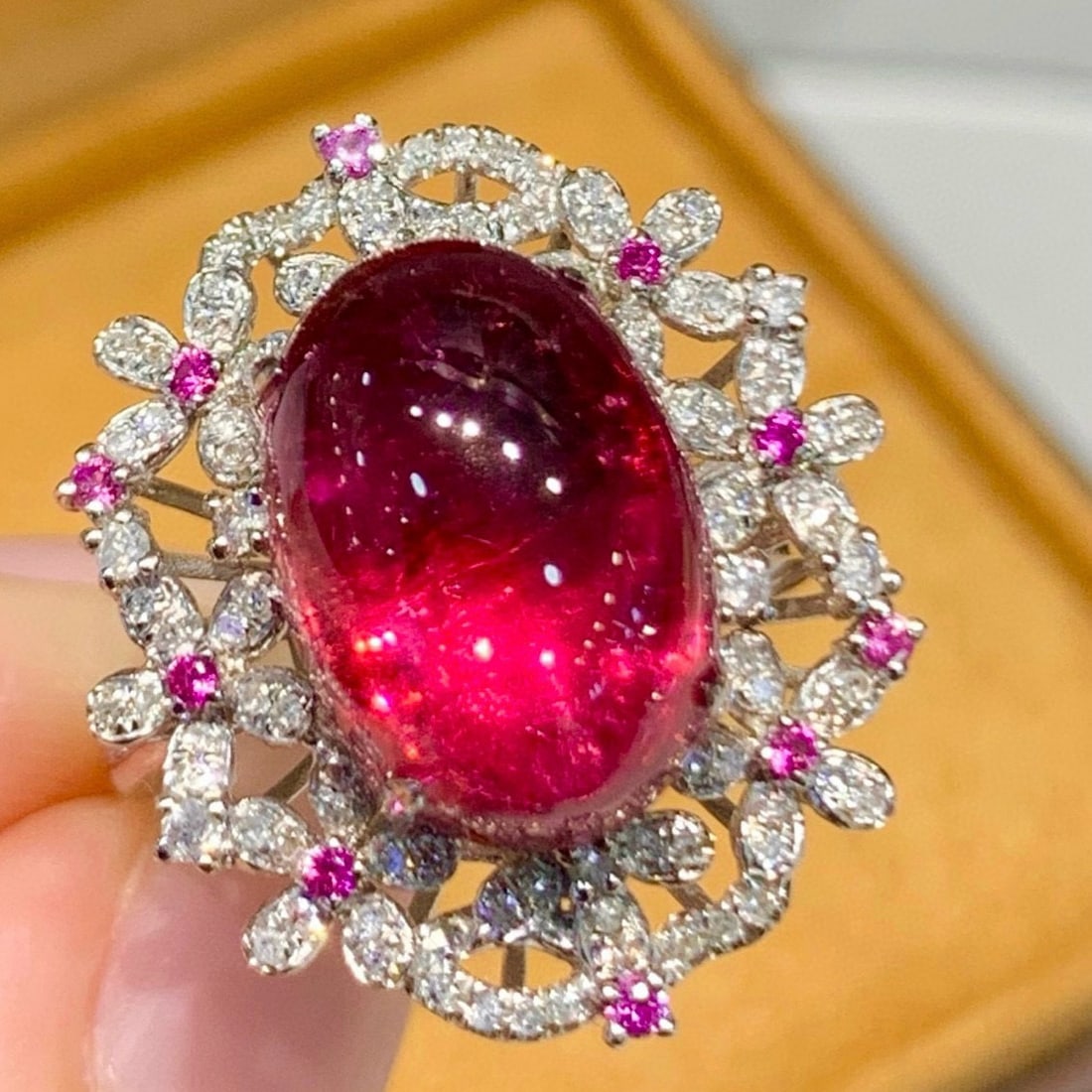 14k Gold 7.3 Ct Natural Tourmaline & Diamond Ring: Ref:231074134 // gold content:14k gold // ring size:7. 25us // // main gemstone:tourmaline // shape:oval // carat weight:7. 3ct // color:red // treatment:natural // // adjacent gemstone 2 : diamond //