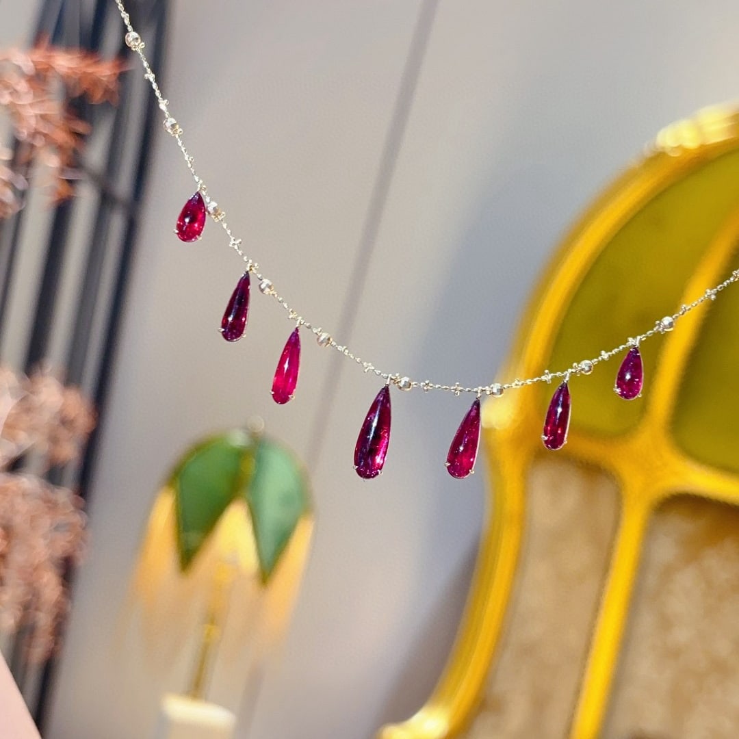 14k Gold 8 Ct Natural Tourmaline Necklace: Ref:231074444 // gold content:14k gold // main gemstone:tourmaline // shape:pear // carat weight:8ct // color:red // treatment:natural // Condition: New Low Estimate: 5700.00 High Estimate: 8600.00