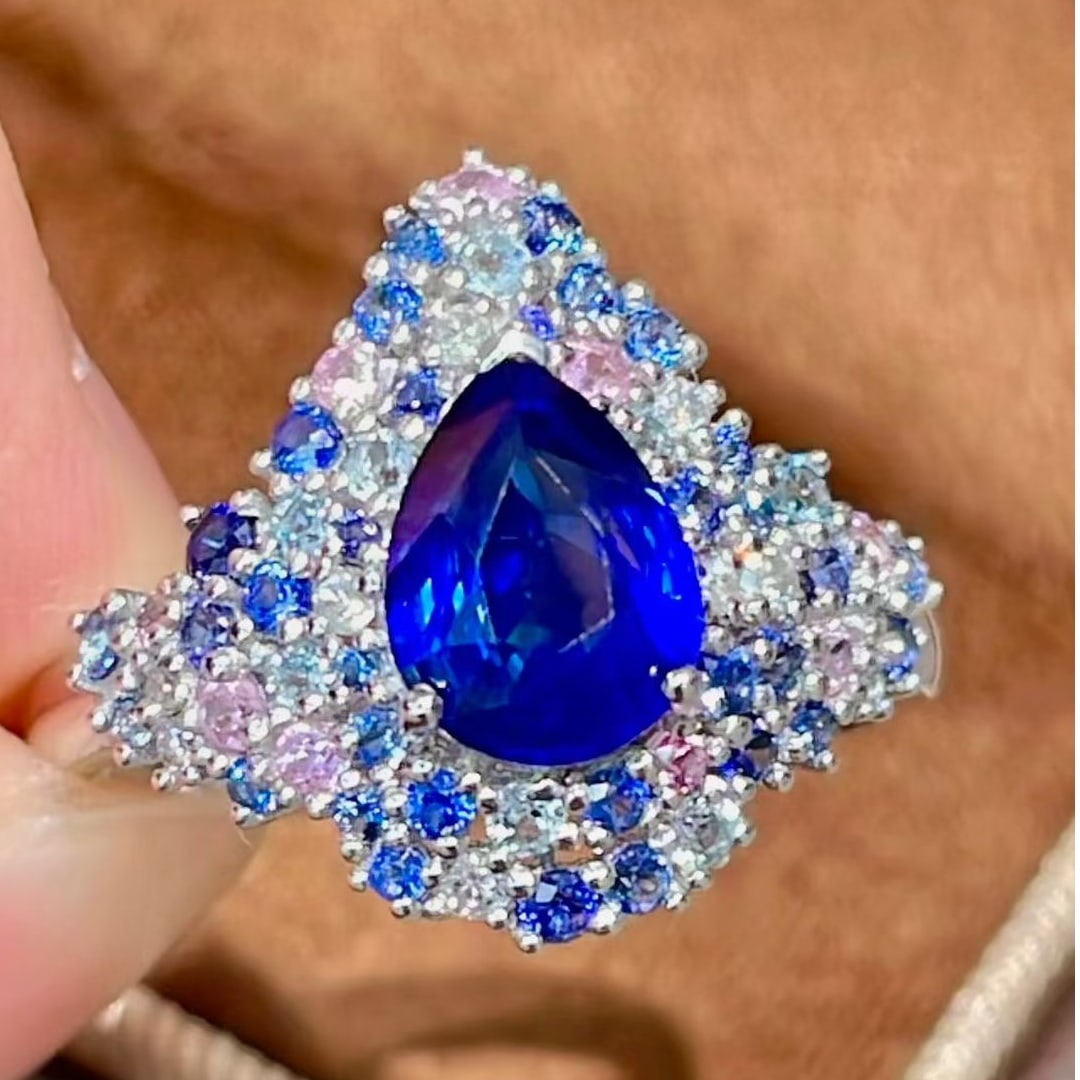 14k Gold 1.59 Ct Vivid Blue Natural Sapphire & Diamond & Sapphire Ring: Ref:231075059 // gold content:14k gold // ring size:7. 25us // // main gemstone:sapphire // shape:pear // carat weight:1. 59ct // color:vivid blue // treatment:natural // // adjacent gemstone 2 :