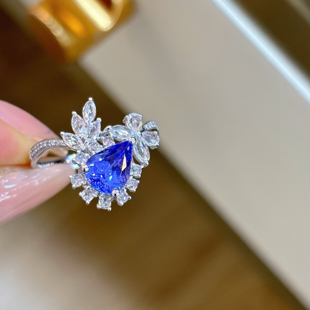 14k Gold 1.1 Ct Natural Tanzanite & Sapphire & Diamond Ring: Ref:231076169 // gold content:14k gold // ring size:7. 25us // // main gemstone:tanzanite // shape:pear // carat weight:1. 1ct // color:blue // treatment:natural // // adjacent gemstone 2 :