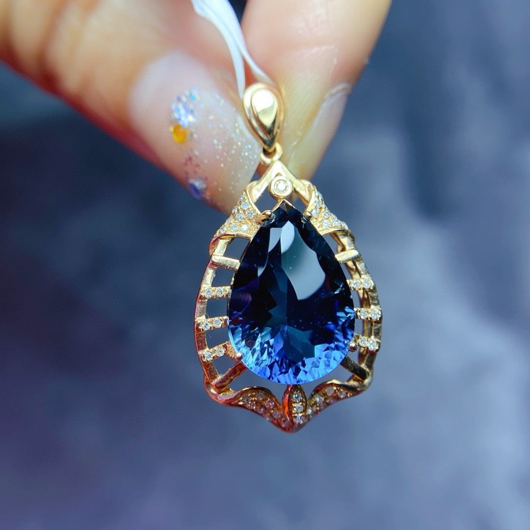 14k Gold 7.8 Ct Natural Topaz & Diamond Pendant( Without Chain ): Ref:231076174 // gold content:14k gold // main gemstone:topaz // shape:pear // carat weight:7. 8ct // color:blue // treatment:natural // // adjacent gemstone 2 : diamond // number of stones:51 // shap
