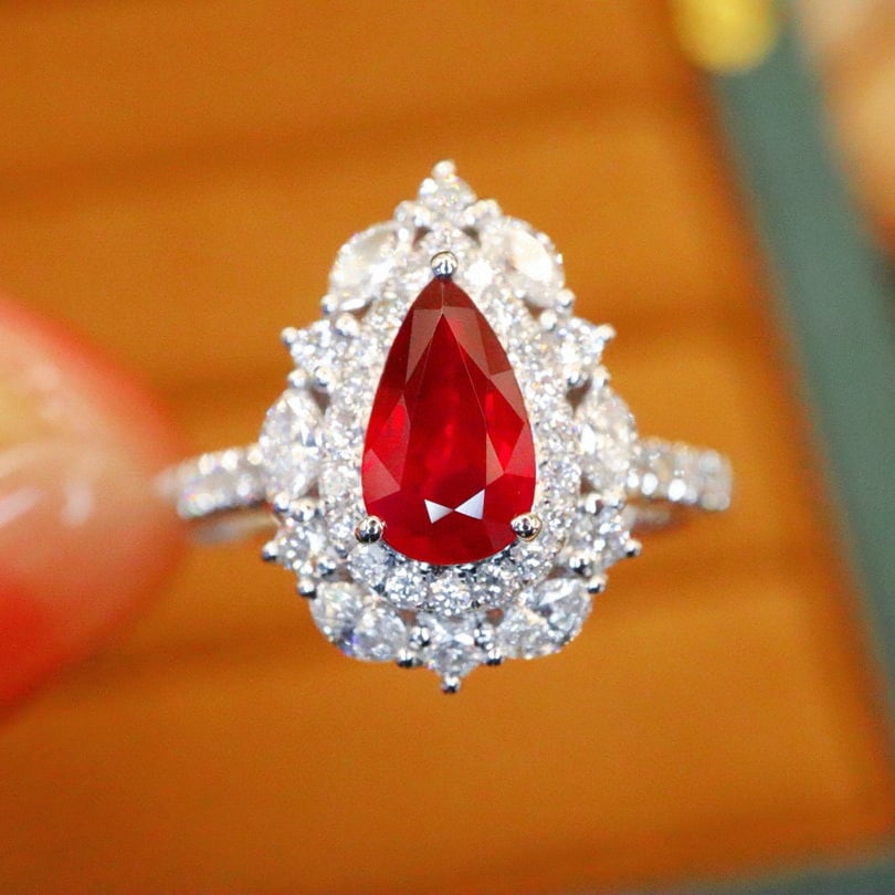 14k Gold 1.77 Ctw Natural Ruby & Diamond Ring: Ref:231076387 // gold content:14k gold // ring size:7. 25us // // main gemstone:ruby // shape:pear // carat weight:1. 04ct // color:pigeonblood red // treatment:natural // // adjacent gemstone 2 :