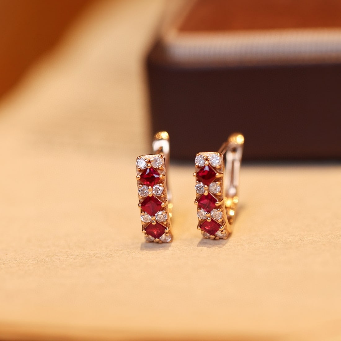 14k Gold 0.91 Ctw Natural Ruby & Diamond Earrings: Ref:231076433 // gold content:14k gold // main gemstone:ruby // shape:princess // carat weight:0. 55ct // color:red // treatment:natural // // adjacent gemstone 2 : diamond // shape:round // carat wei