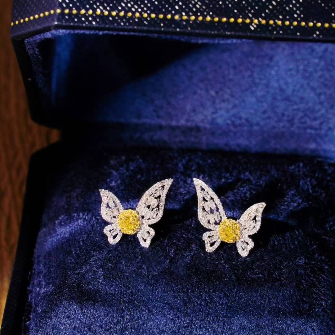 14k Gold 0.86 Ct Natural Yellow Diamond & Diamond Butterfly Earrings: Ref:230947040 // gold content:14k gold // main gemstone:emerald // shape:oval // carat weight:11. 05ct // color:green // treatment:natural // Condition: NewLow Estimate: 2900.00High Estimate: 4300.00