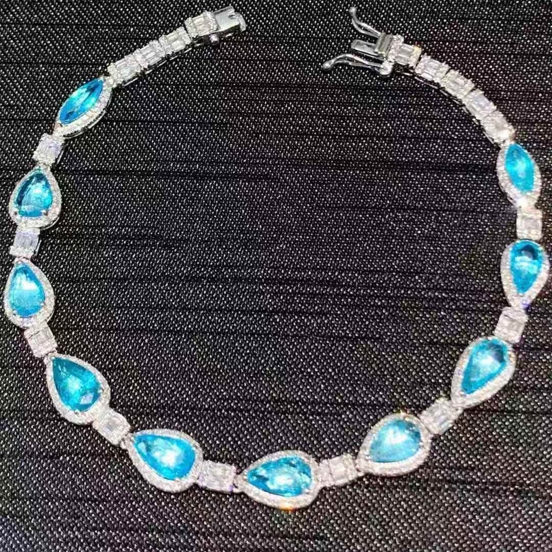 14k Gold 3.1 Ct Natural Paraiba Tourmaline & Diamond Bracelet: Ref:230947127 // gold content:14k gold // main gemstone:ruby // shape:square // carat weight:6ct // color:red // treatment:natural // // adjacent gemstone 2 : diamond // shape:round // carat