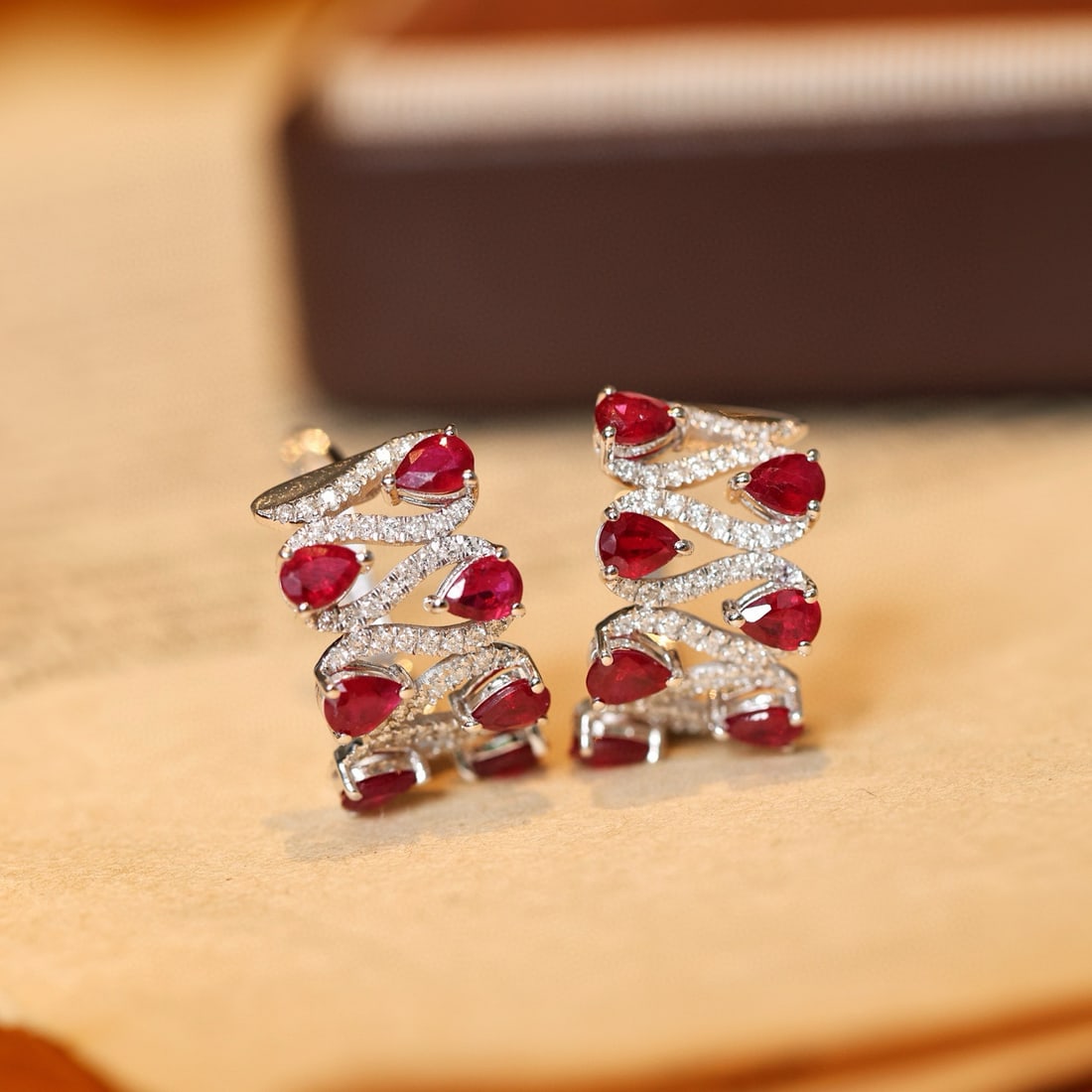 14k Gold 2.96 Ctw Natural Ruby & Diamond Earrings: Ref:231078053 // gold content:14k gold // main gemstone:ruby // shape:pear // carat weight:2. 43ct // color:pigeonblood red // treatment:natural // // adjacent gemstone 2 : diamond // shape:round // c