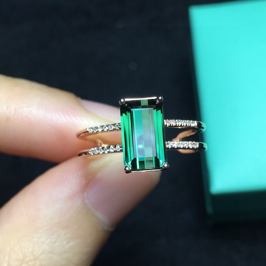 14k Gold 2.1 Ct Natural Tourmaline & Diamond Ring: Ref:231078201 // gold content:14k gold // ring size:7. 25us // // main gemstone:tourmaline // shape:octagonal // carat weight:2. 1ct // color:green // treatment:natural // // adjacent gemstone 2 :