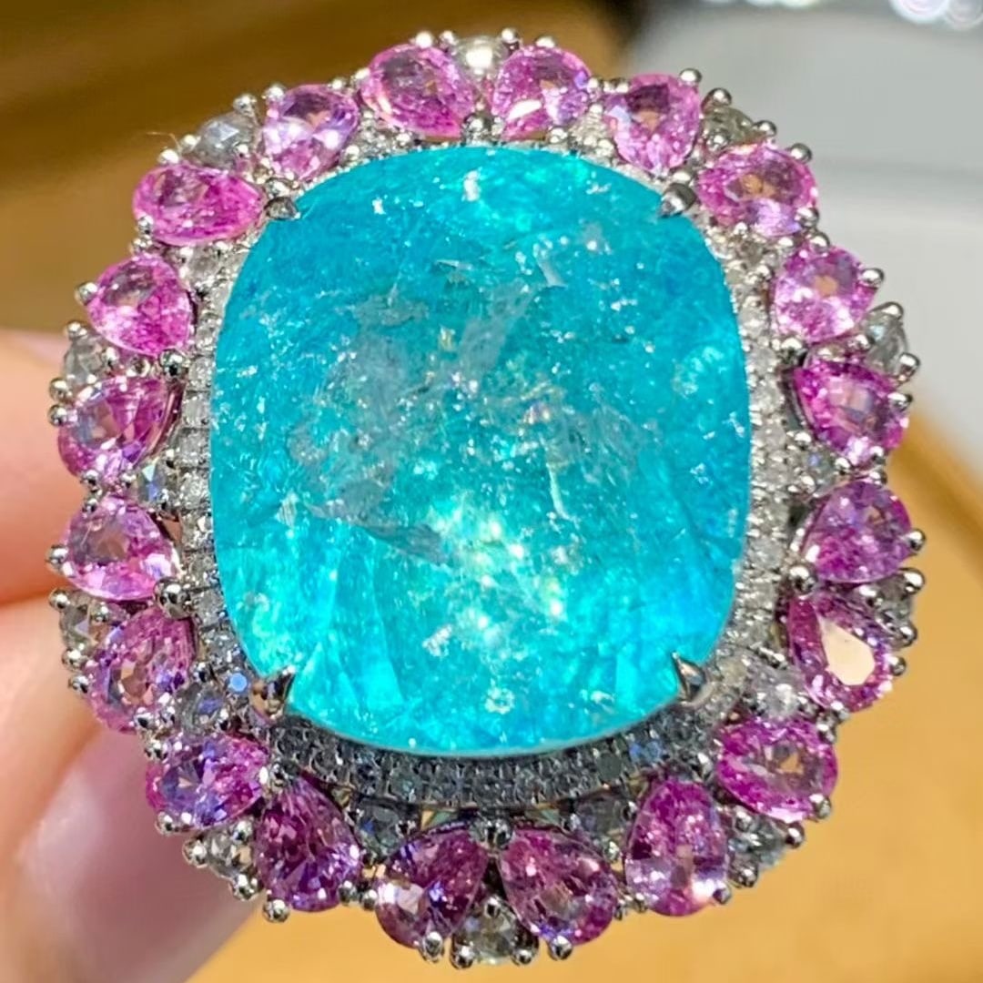 14k Gold 14.3 Ct Natural Paraiba Tourmaline & Sapphire & Diamond Ring: Ref:231079011 // gold content:14k gold // ring size:7. 25 us // // main gemstone:paraiba tourmaline // shape:cushion // carat weight:14. 3ct // color:neon blue // treatment:natural // // adjacent gems
