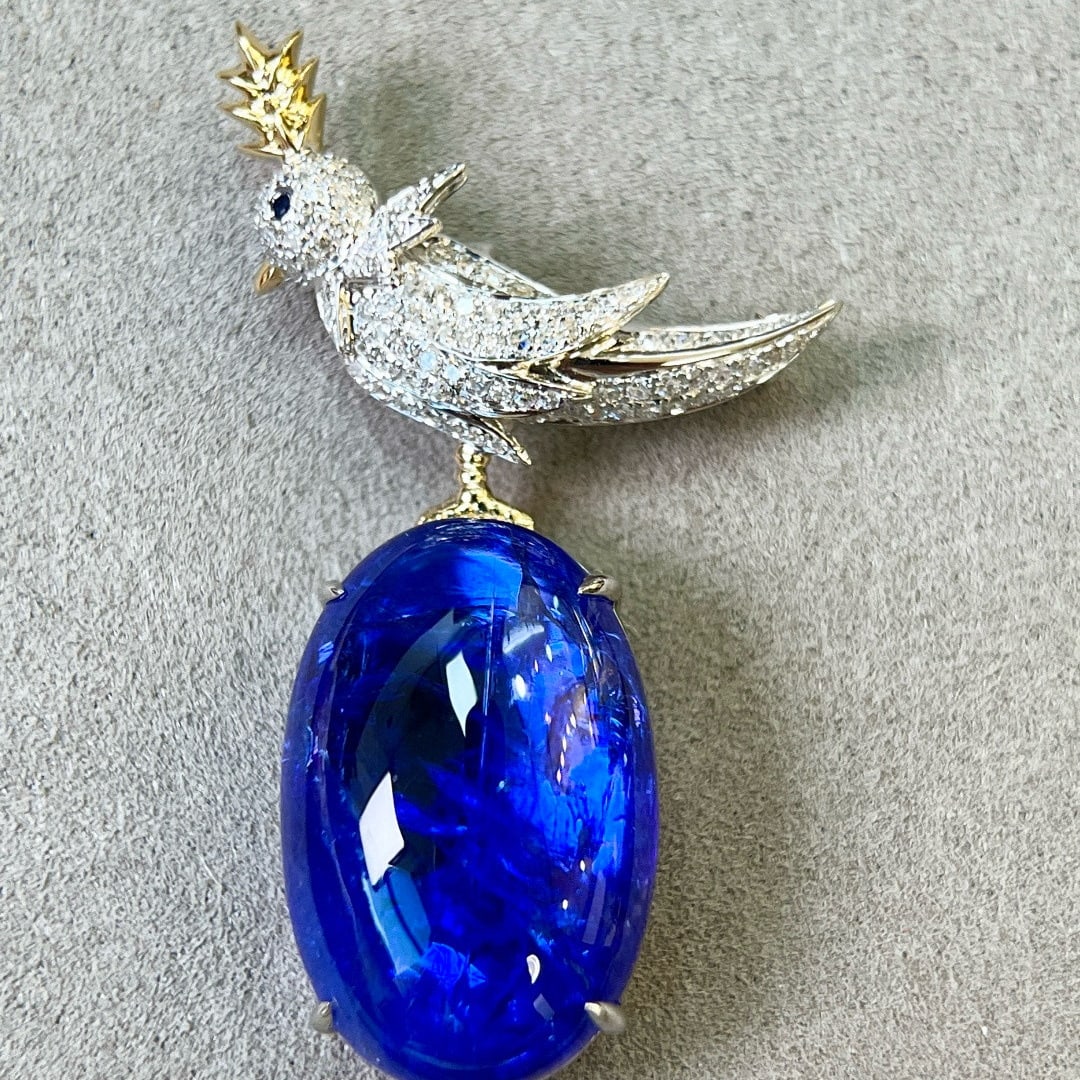 14k Gold 17.89 Ctw Natural Tanzanite & Diamond Brooch/pendant( Without Chain ): Ref:231079050 // gold content:14k gold // main gemstone:tanzanite // shape:oval // carat weight:17. 45ct // color:blue // treatment:natural // // adjacent gemstone 2 : diamond // shape:round //