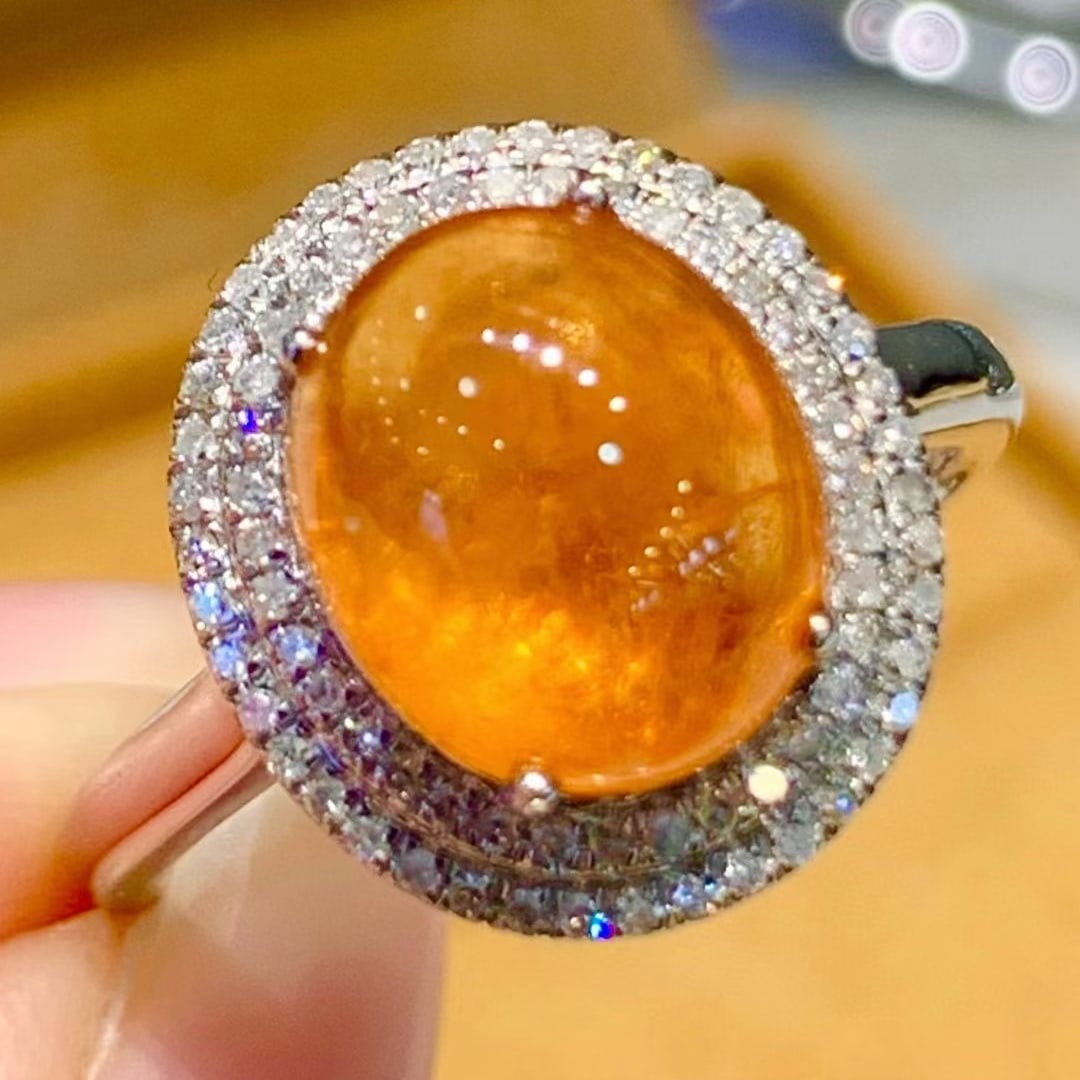 14k Gold 5.5 Ct Natural Spessartine & Diamond Ring: Ref:231079090 // gold content:14k gold // ring size:7. 25 us // // main gemstone:spessartine // shape:oval // carat weight:5. 5ct // color:orange // treatment:natural // // adjacent gemstone 2 :