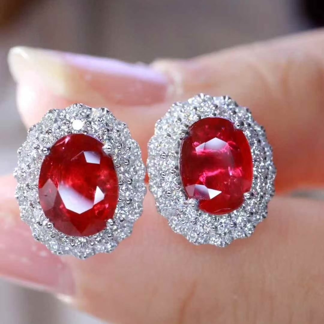 14k Gold 2.58 Ctw Natural Ruby & Diamond Earrings: Ref:231079101 // gold content:14k gold // main gemstone:ruby // number of stones:2 // shape:oval // carat weight:2. 01ct // color:red // treatment:natural // // adjacent gemstone 2 : diamond //