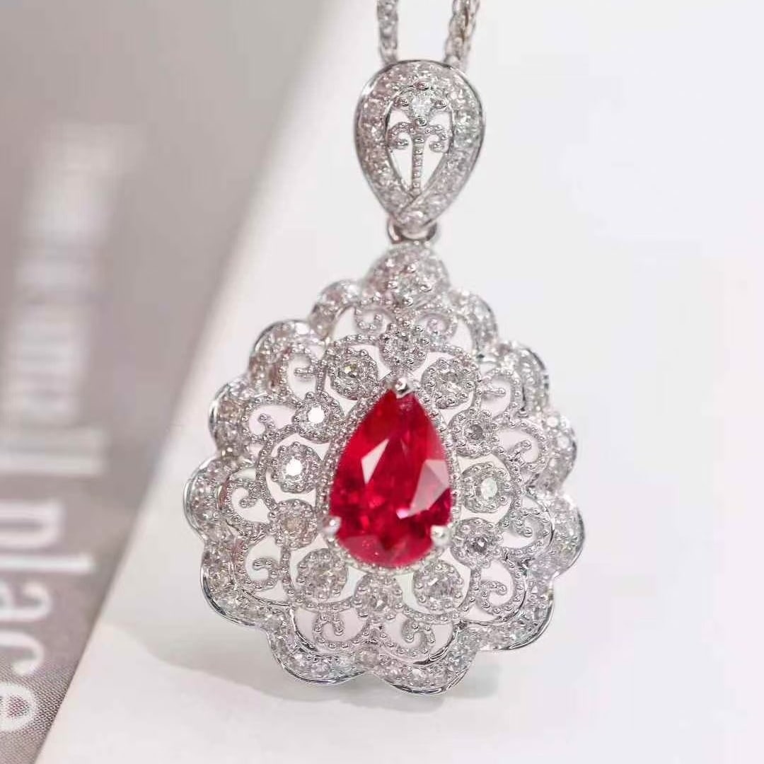 14k Gold 1.09 Ctw Natural Ruby & Diamond Pendant( Without Chain ): Ref:231079106 // gold content:14k gold // main gemstone:ruby // shape:pear // carat weight:0. 8ct // color:red // treatment:natural // // adjacent gemstone 2 : diamond // shape:round // carat