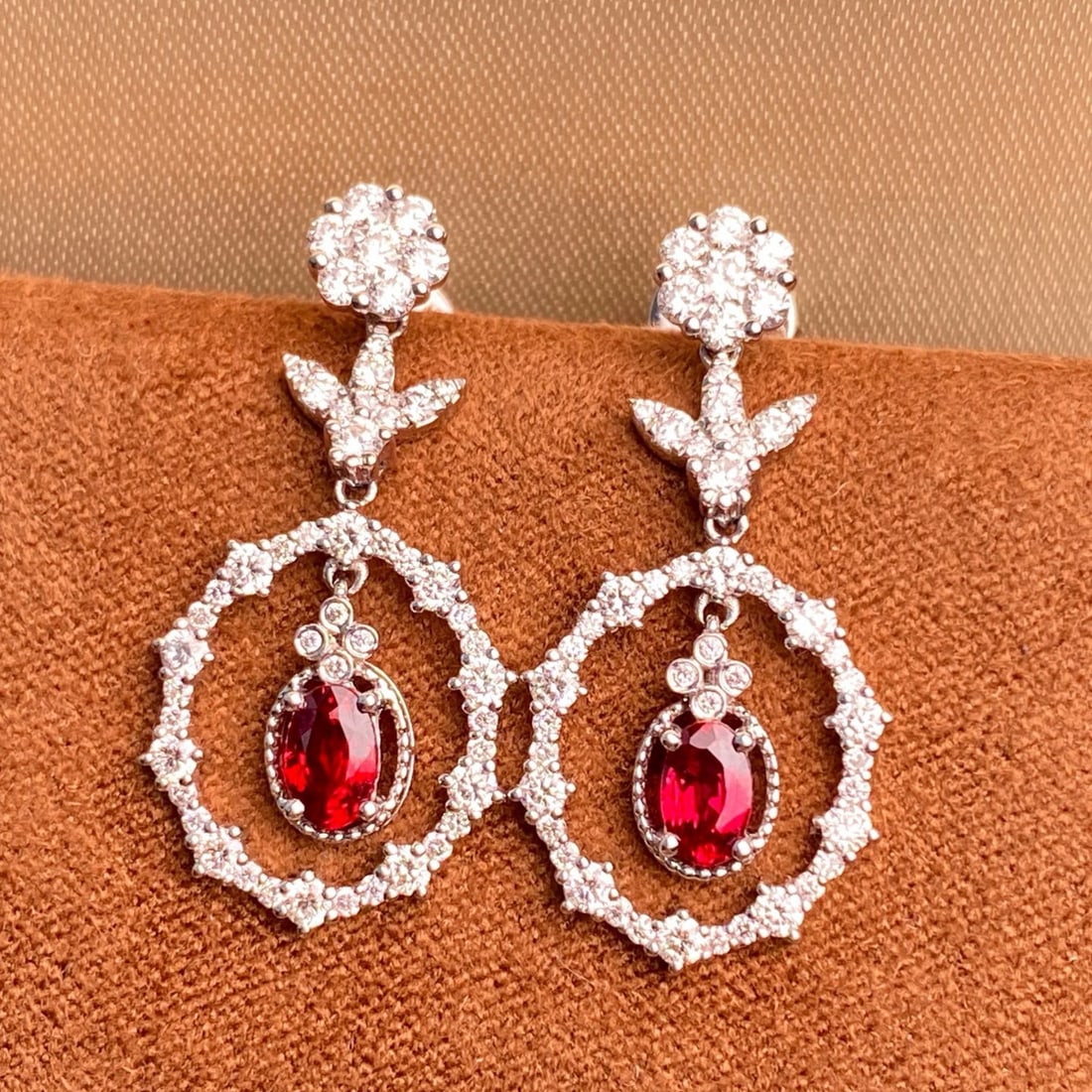 14k Gold 1.84 Ctw Natural Ruby & Diamond Earrings: Ref:231080041 // gold content:14k gold // main gemstone:ruby // shape:oval // carat weight:0. 76ct // color:red // treatment:natural // // adjacent gemstone 2 : diamond // shape:round // carat weight: