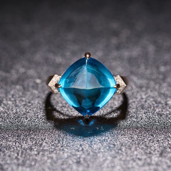 14k Gold 12.6 Ct Natural Topaz & Diamond Ring: Ref:231080044 // gold content:14k gold // ring size:7. 25us // // main gemstone:topaz // shape:sugar-loaf // carat weight:12. 6ct // color:blue // treatment:natural // // adjacent gemstone 2 : diamond