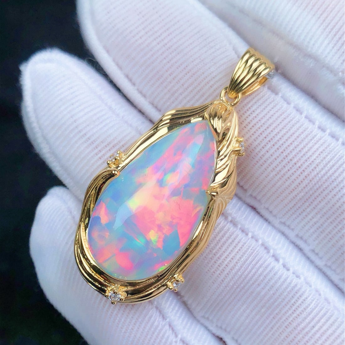 14k Gold 12.56 Ctw Natural Opal & Diamond Pendant( Without Chain ): Ref:231080330 // gold content:14k gold // main gemstone:opal // shape:pear // carat weight:12. 48ct // color:color // treatment:natural // // adjacent gemstone 2 : diamond // shape:round // carat
