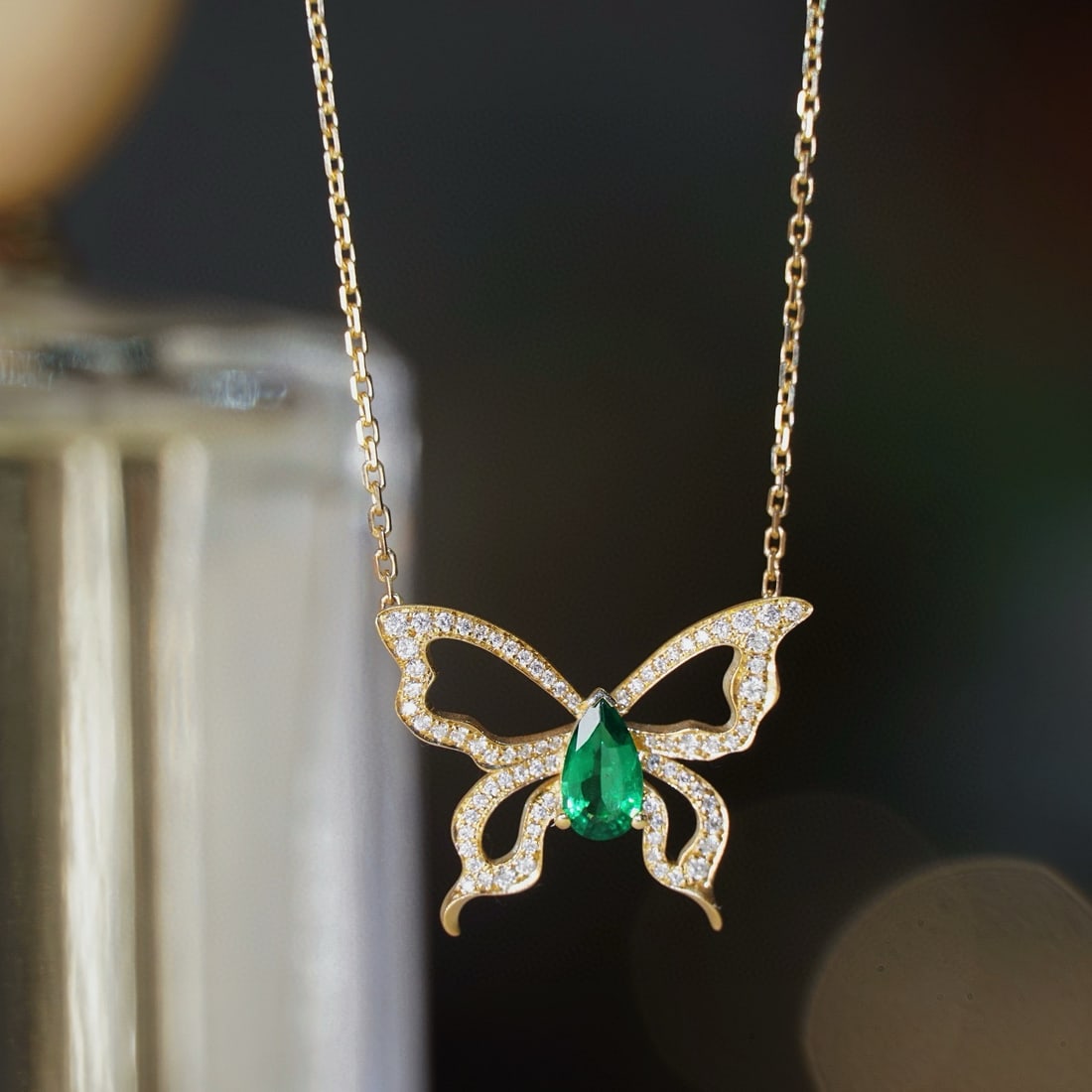 14k Gold 0.63 Ctw Vivid Green Natural Emerald & Diamond & Butterfly Necklace: Ref:231080444 // gold content:14k gold // main gemstone:emerald // shape:pear // carat weight:0. 39ct // color:vivid green // treatment:natural // // adjacent gemstone 2 : diamond // shape:round //