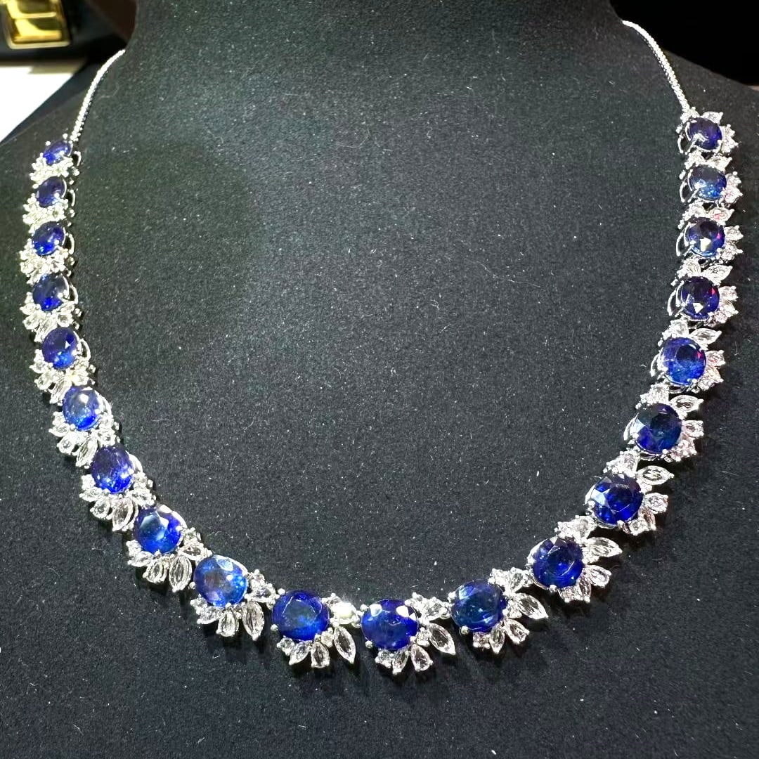 14k Gold 18.85 Ct Vivid Blue Natural Sapphire & Sapphire Necklace: Ref:231081010 // gold content:14k gold // main gemstone:sapphire // shape:oval // carat weight:18. 85ct // color:vivid blue // treatment:natural // // adjacent gemstone 2 : sapphire // shape:multiple