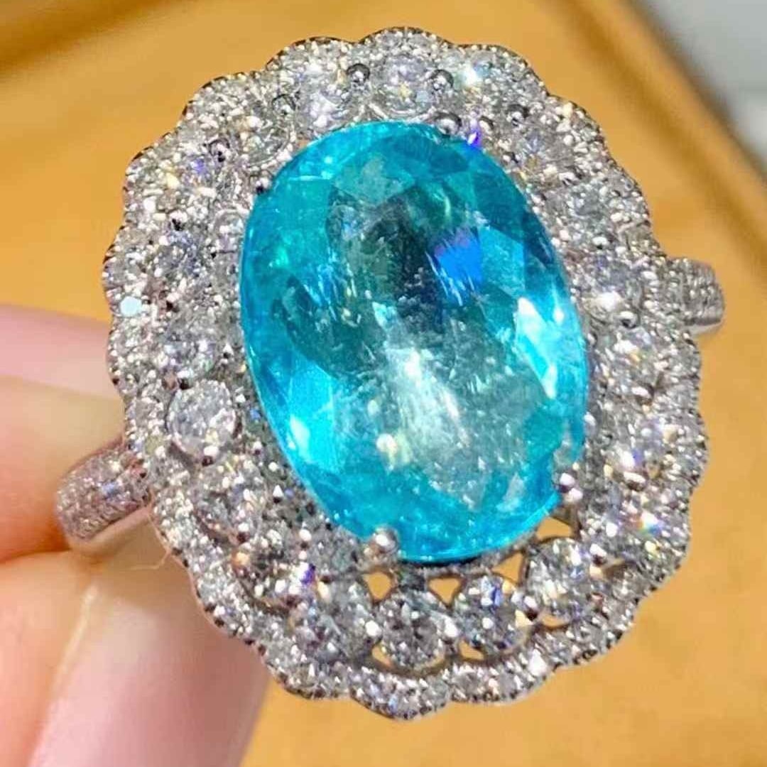 14k Gold 2.95 Ct Natural Paraiba Tourmaline & Diamond Ring: Ref:231081015 // gold content:14k gold // ring size:7. 25us // // main gemstone:paraiba tourmaline // shape:oval // carat weight:2. 95ct // color:blue // treatment:natural // // adjacent gemstone 2 :