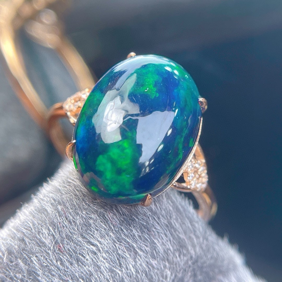 14k Gold 5.5 Ct Natural Opal & Diamond Ring: Ref:231081237 // gold content:14k gold // ring size:7. 25us // // main gemstone:opal // shape:oval // carat weight:5. 5ct // color:color // treatment:natural // // adjacent gemstone 2 : diamond //