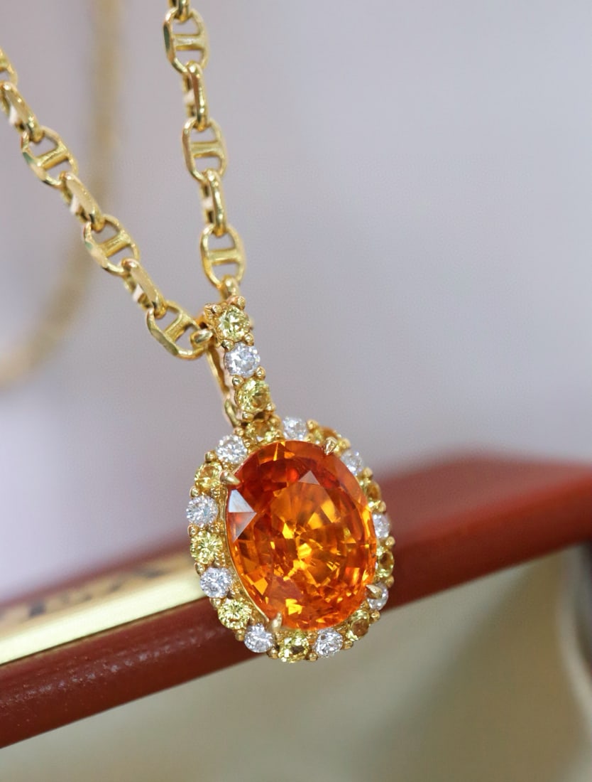 14k Gold 2.75 Ctw Natural Spessartine & Diamond Pendant( Without Chain ): Ref:231082437 // gold content:14k gold // main gemstone:spessartine // shape:oval // carat weight:2. 56ct // color:orange // treatment:natural // // adjacent gemstone 2 : diamond // shape:round //