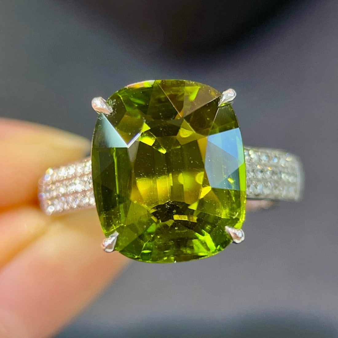 14K GOLD 6.80 CTW NATURAL TOURMALINE & DIAMOND RING: Ref:231083051 // Gold Content:14K Gold // Ring Size:7.25 US // // Main Gemstone:Tourmaline // Shape:Cushion // Carat Weight:6.60ct // Color:Yellowish Green // Treatment:Natural // // Adjacent