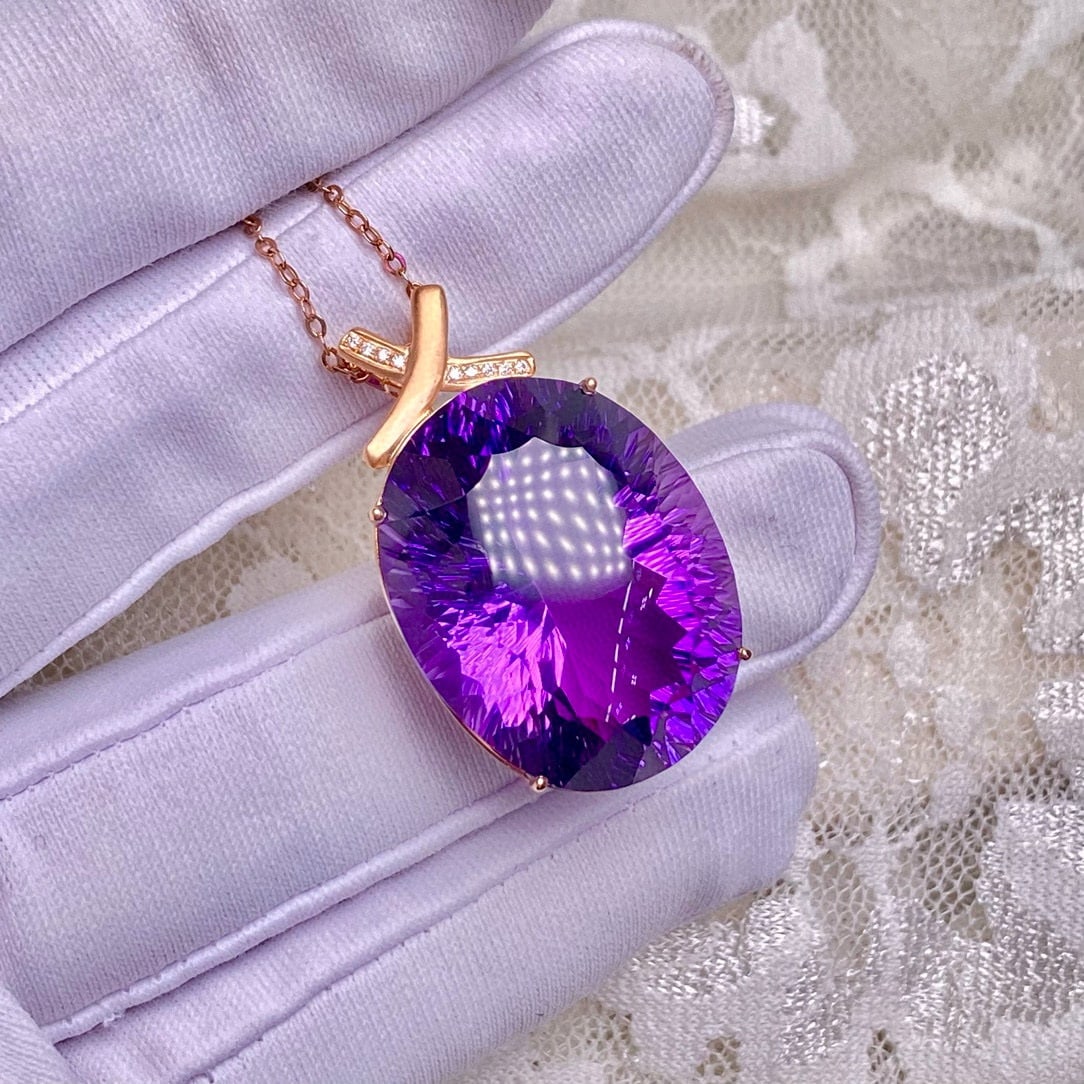 14K GOLD 34.1 CT NATURAL AMETHYST & DIAMOND PENDANT( WITHOUT CHAIN ): Ref:231083176 // Gold Content:14K Gold // Main Gemstone:Amethyst // Shape:Oval // Carat Weight:34.1ct // Color:Purple // Treatment:Natural // // Adjacent Gemstone 2 : Diamond // Number of stones:9 //