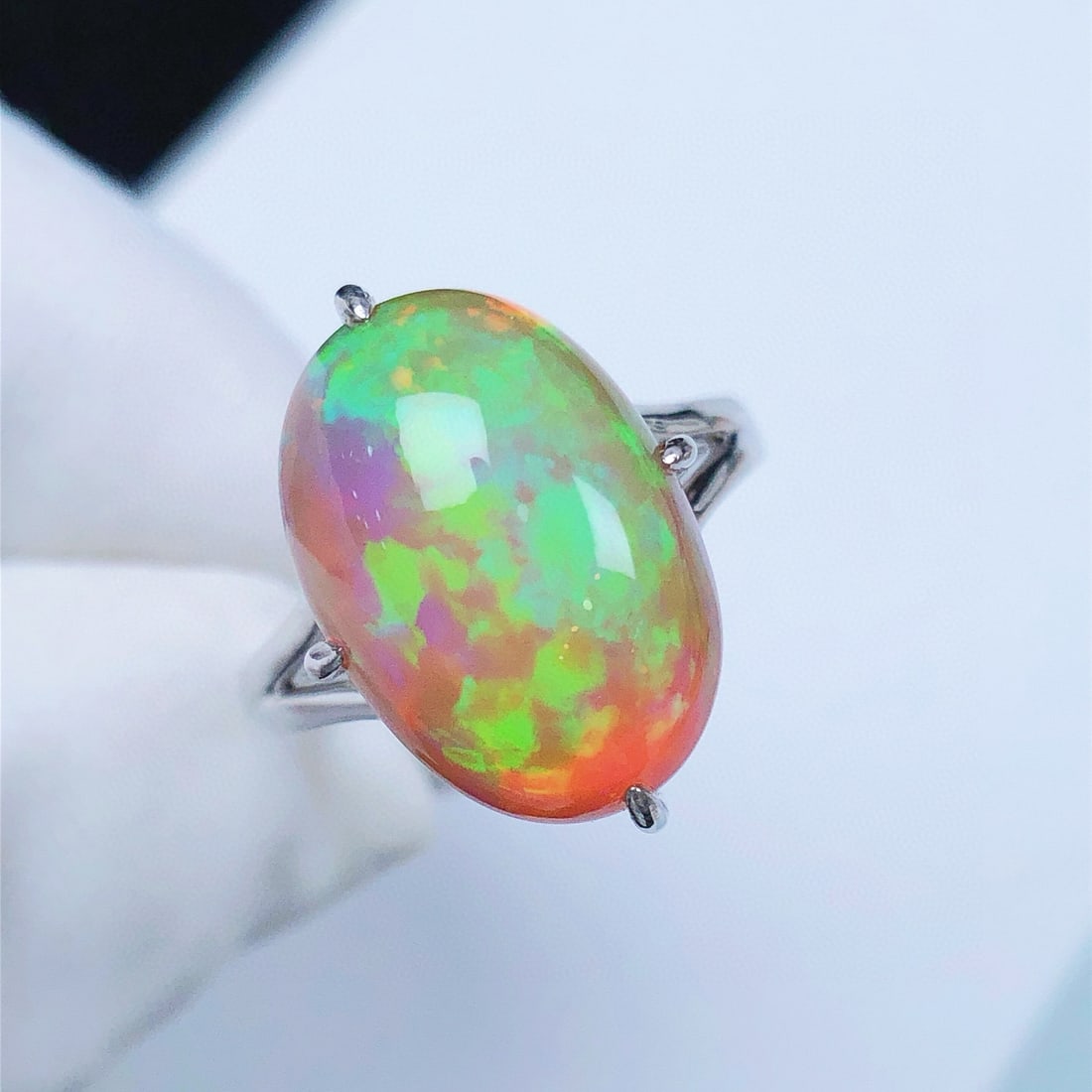 14K GOLD 7.21 CT NATURAL OPAL RING: Ref:231084041 // Gold Content:14K Gold // Ring Size:7.25US // // Main Gemstone:Opal // Shape:Oval // Carat Weight:7.21ct // Color:Color // Treatment:Natural // Condition: New Low Estimate: 3500.00 Hi