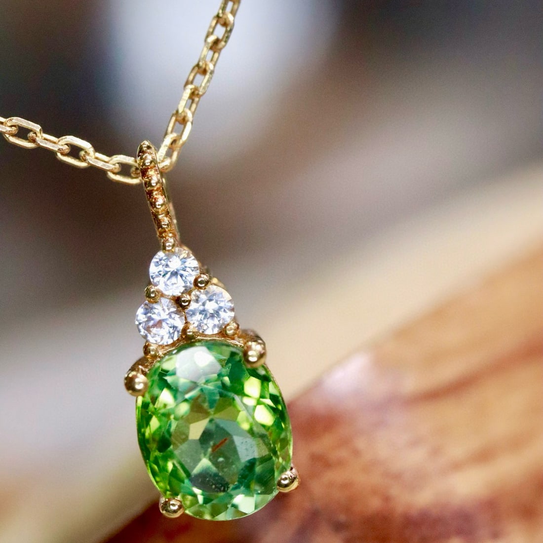 14K GOLD 0.92 CTW NATURAL TOURMALINE & SAPPHIRE PENDANT( WITHOUT CHAIN ): Ref:231084093 // Gold Content:14K Gold // Main Gemstone:Tourmaline // Shape:Oval // Carat Weight:0.86ct // Color:Green // Treatment:Natural // // Adjacent Gemstone 2 : Sapphire // Shape:Round //