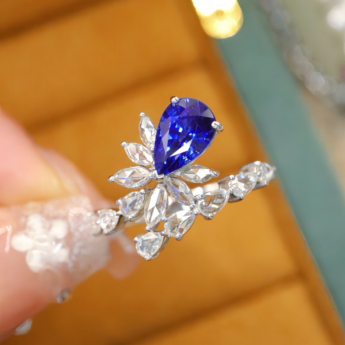 14K GOLD 1.74 CTW NATURAL SAPPHIRE & DIAMOND RING: Ref:231084114 // Gold Content:14K Gold // Ring Size:7.25US // // Main Gemstone:Sapphire // Shape:Pear // Carat Weight:1.29ct // Color:Royal blue // Treatment:Natural // // Adjacent Gemstone 2 : Diamon