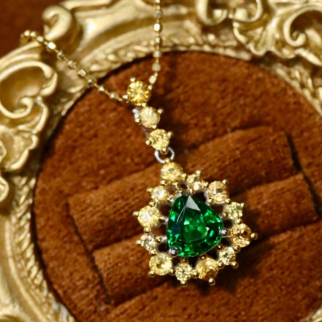 14K GOLD 1.49 CTW VIVID GREEN NATURAL TSAVORITE & SAPPHIRE PENDANT( WITHOUT CHAIN ): Ref:231084139 // Gold Content:14K Gold // Main Gemstone:Tsavorite // Shape:Pear // Carat Weight:0.75ct // Color:Vivid Green // Treatment:Natural // // Adjacent Gemstone 2 : Sapphire // Shape:Round