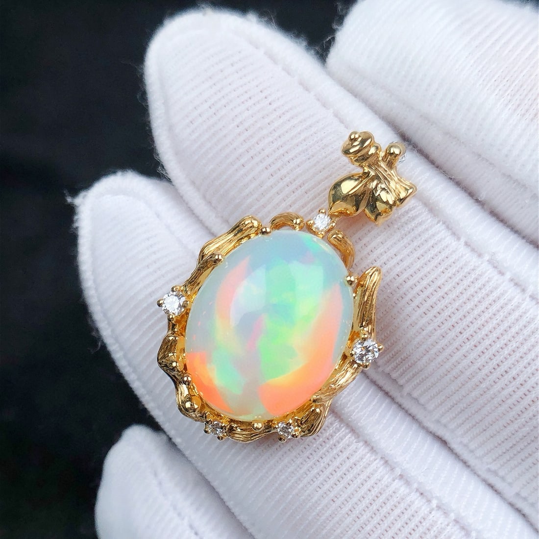 14K GOLD 6.04 CTW NATURAL OPAL & DIAMOND PENDANT( WITHOUT CHAIN ): Ref:231084252 // Gold Content:14K Gold // Main Gemstone:Opal // Shape:Oval // Carat Weight:5.92ct // Color:Color // Treatment:Natural // // Adjacent Gemstone 2 : Diamond // Shape:Round // Carat