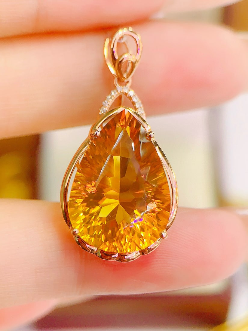 14k Gold 10.73 Ctw Natural Citrine & Diamond Pendant( Without Chain ): Ref:231111103 // gold content:14k gold // main gemstone:citrine // shape:pear // carat weight:10. 7ct // color:yellow // treatment:natural // // adjacent gemstone 2 : diamond // number of stones:10